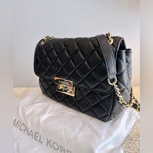 Brand new MK leather quilted bag. Dust bag included.